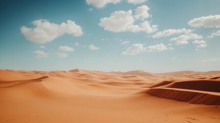 Fototapeta premium Vast Desert Landscape with Soft Rolling Sand Dunes and Clouds