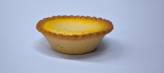 Egg tarts that are crispy on the outside and soft on the inside. Egg tarts that have a rich and creamy egg aroma. Egg tarts on white background.