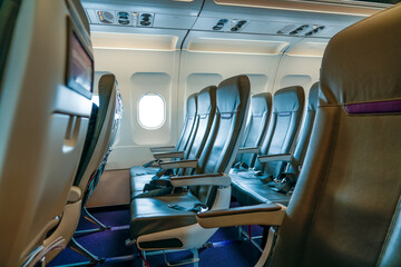 Empty aircraft seats interior porthole windows