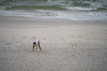 picking shells on the beach