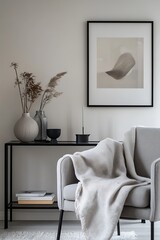 Modern Interior with Minimalist Decor, Vases, Dry Plants, Grey Couch, and Framed Art