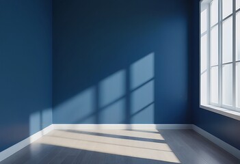 Obraz premium a moody, empty room features deep blue walls dramatically lit by strong shadows cast from a bright white-framed window.