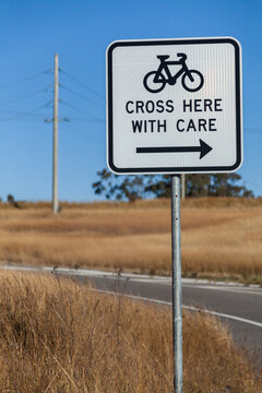 Sign for cyclists cross here with care