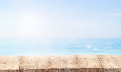 summer background of calm sea and wooden table with copy space