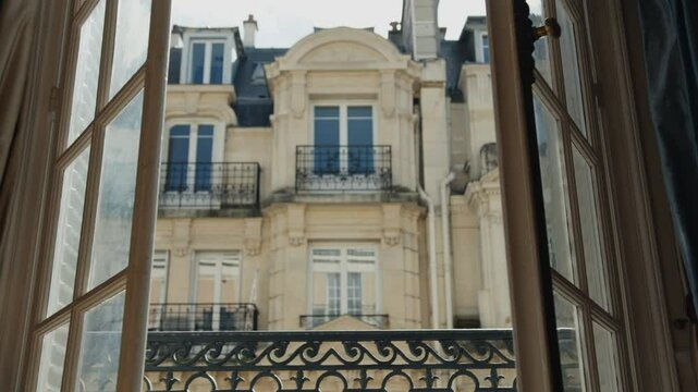 French balcony opening onto parisian building