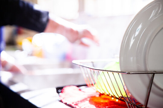 Dishes drying in dish rack