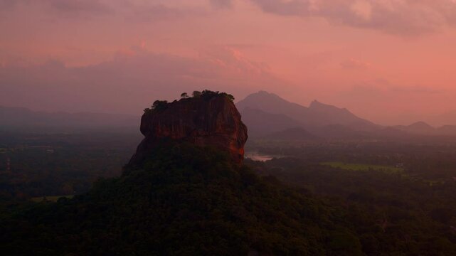 Breathtaking view of Mount Sigiriya from Pidurangala Rock at sunsets. A must-see panorama in Sri Lanka, timelapse in sunset light. Lion Rock is protected by UNESCO as a World Heritage Site