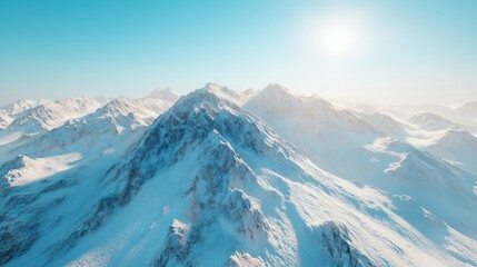 Obraz premium A breathtaking aerial view of snow-covered mountains under a clear blue sky, showcasing nature's serene beauty and majesty.
