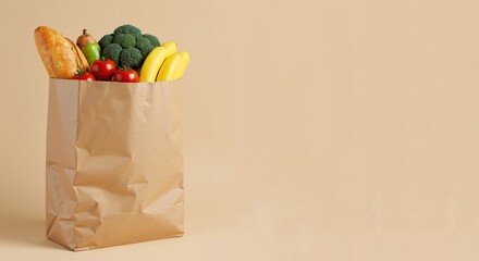 Fresh groceries in a paper bag on a neutral background  
