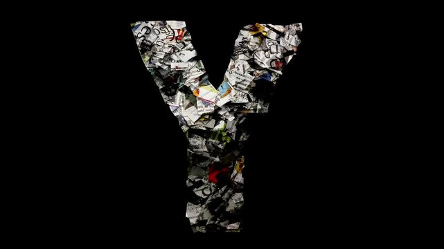letter Y with cut up newspaper isolated on black 