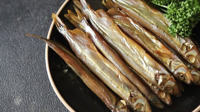 Fish smoked capelin sprat  dish fresh delicious gourmet food background on table rustic food top view copy space pescetarian diet