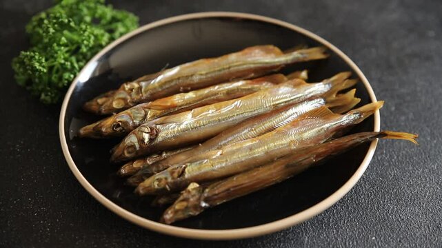 Fish smoked capelin sprat  dish fresh delicious gourmet food background on table rustic food top view copy space pescetarian diet