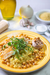 grilled cod with couscous, chicken pea and baked garlic