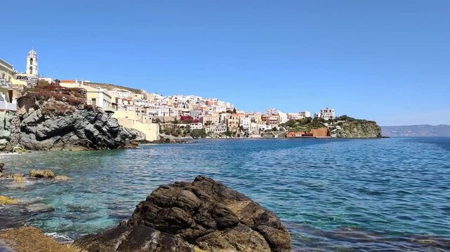 Picturesque view of Syros, a stunning Greek island in the Cyclades, nestled in the Aegean Sea, known for its neoclassical architecture, vibrant culture, and scenic coastal charm.