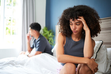 Young Couple in Bedroom Facing Tension and Emotional Distance