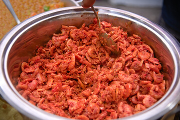Acarajé. Preparing shrimp for Acarajé in a steel pan. Traditional Brazilian food