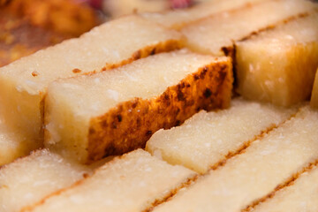 Traditional baked sweet cassava cake with coconut called 