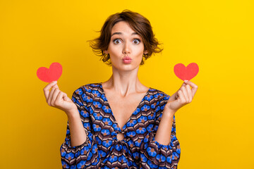 Portrait of girlfriend in blouse plump lips sending you air kiss holding red paper postcard heart...