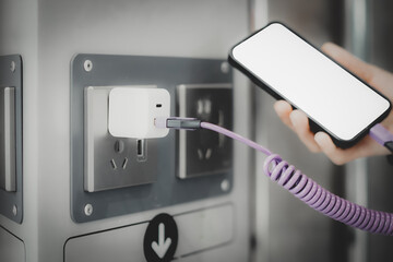 Modern Charging Station with Smartphone and Adapter in Use