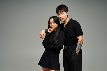 Stylish couple sharing a moment of love and romance in a modern studio setting