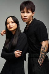 Stylish couple expressing love and elegance in a modern photography studio setting