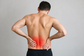 Obraz premium Man with lower back pain, redness on skin, muscular strain