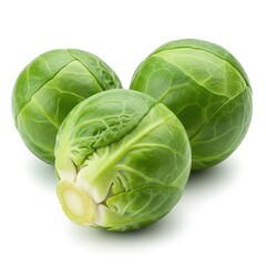Fototapeta premium A close up shot of three green brussel sprouts on a white background in a studio setting today