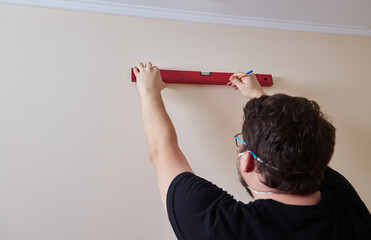 Person Marking Wall with Level
