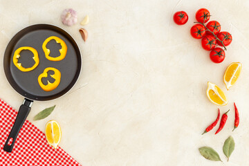 Cooking frame with tomatoes cutting vegetables and spices, top view. Menu concept