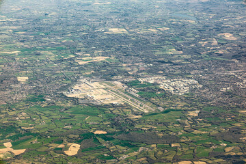 Aerial view of Gatwick Airport and the surrounding towns, villages and countryside of West Sussex in England