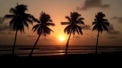 Obraz premium Silhouettes of palm trees at sunset over a tranquil ocean beach.
