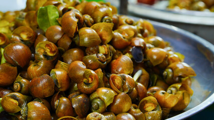 Close-up of steamed mussels, a Thai food sold at tourist attractions in Thailand.