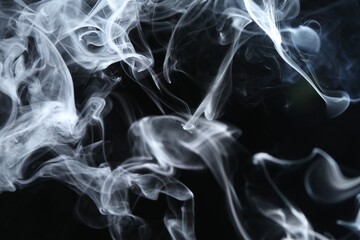 Fototapeta premium Beautiful white smoke flowing on dark background