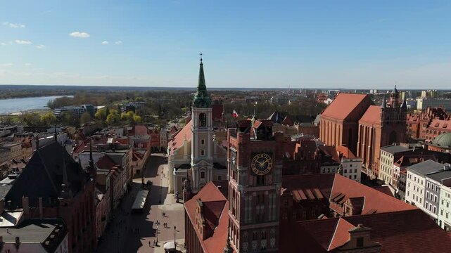Aerial view on sunny day of historical tourist center of medieval city Torun, old town, churches, cathedrals and Vistula river, Poland, Europe