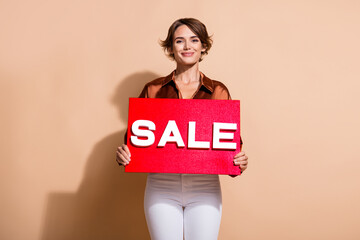 Photo of pretty shiny woman wear brown blouse announcing big black friday sale isolated beige color background
