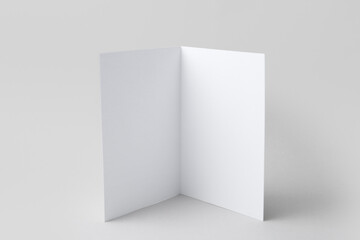 One blank greeting card on light background