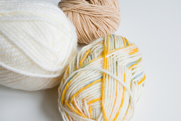 Colorful yarn collection on white background