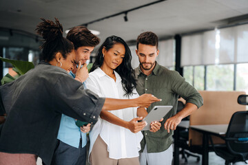 Group of busy happy diverse professional business team people working in office using digital tablet