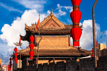 Traditional building and red lanterns on old wall in Xian, China
