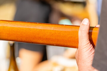 Close up of hands playing acoustic guitar fretboard Fingers forming chord on steel string acoustic...
