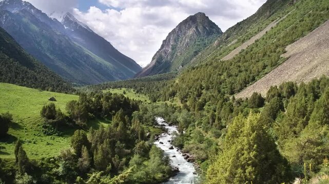 4K drone footage showcases Ala Archa National Park in Kyrgyzstan, featuring alpine meadows, rocky ridges, and glacier-fed streams in the Tien Shan Mountains.