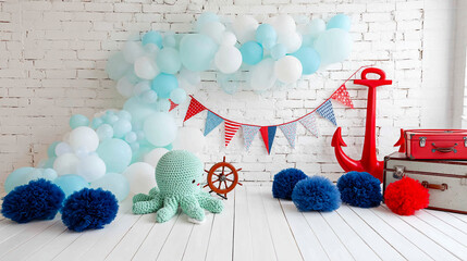 White brick background, light-blue balloons, red anchor, nautical decorations,  crochet octopus, pom-poms, suitcases,  creating a playful, nautical themed photoshoot scene