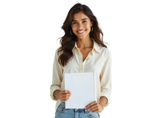 Naklejka premium Business portrait isolated on white transparent background: A smiling young woman with wavy brown hair holds a blank white sheet of paper against a plain white background, dressed in a cream-colored