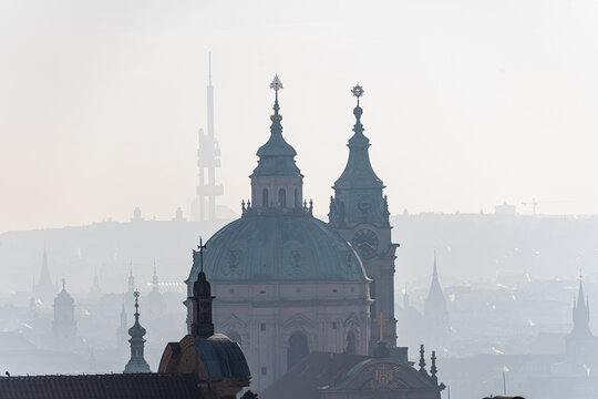 Misty morning view over historical landmarks in Prague