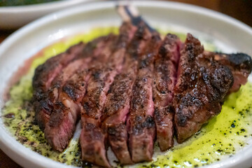 Medium rare angus steak served on plate