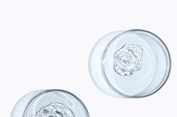 Skin serum or face wash gel in a Petri dish. For cosmetic procedures.