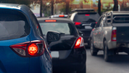 Transportation luxury of blue cars on the road. Open light brake waiting to release traffic signals in the intersection. Heavy traffic. Many cars in queue and traffic jam.