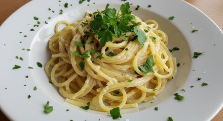 Spaghetti with sauce and parsley on a white plate food presentation.