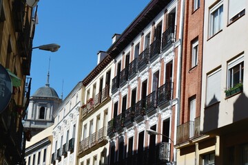 Colorful buildings line the street in Madrid, Spain