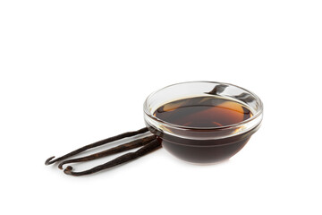 Vanilla extract in glassware isolated on white background. Vanilla extract for baking and desserts. Aromatic Homemade Vanilla Extract. Close -up. Place for the text. Copy space.